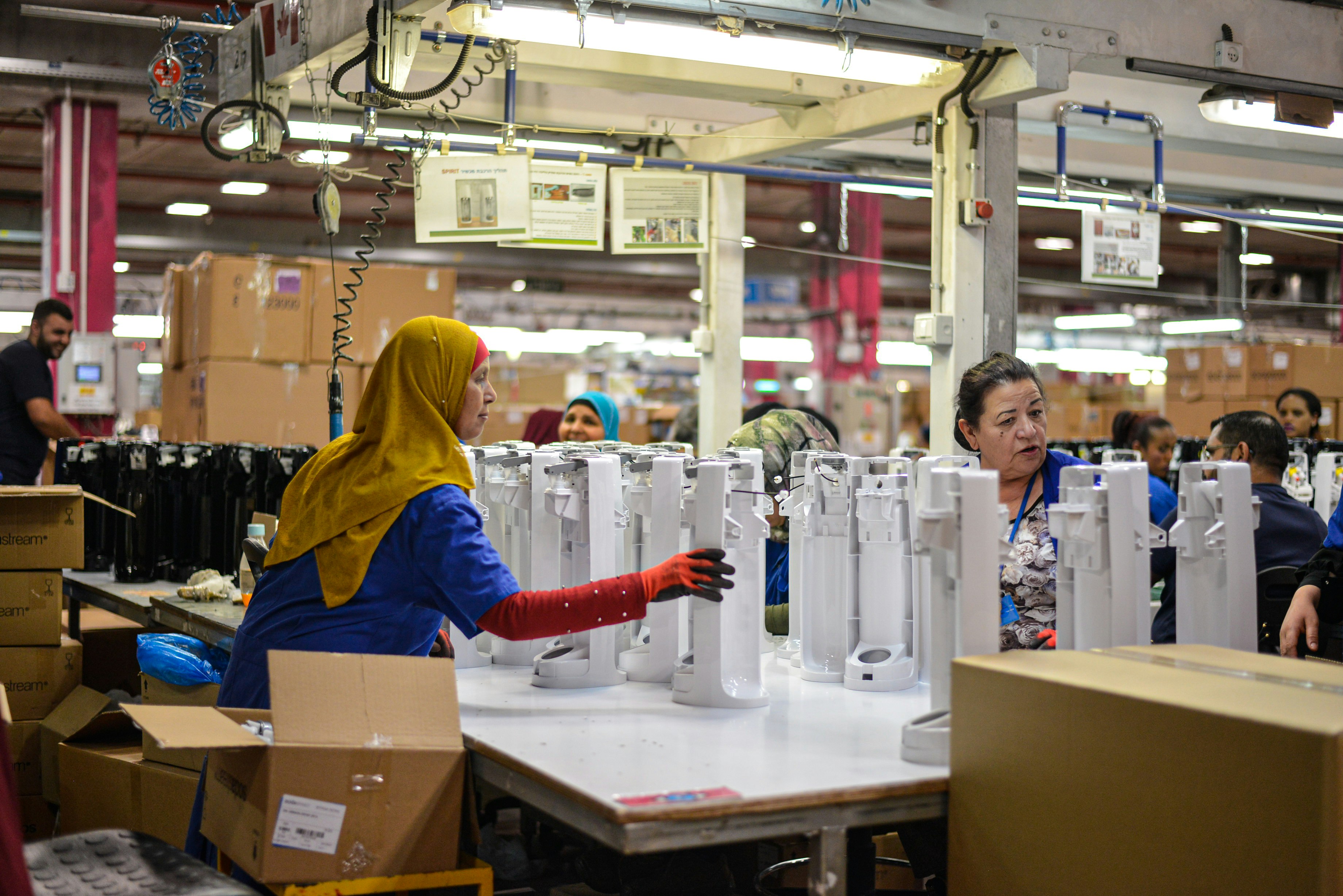 Surat, Gujarat, India factory workers technicians using amazon/flipkart reseller profit margin calculator
